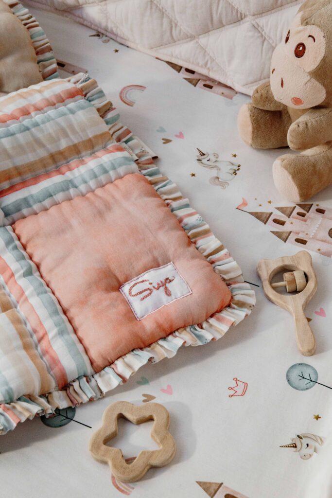 MiRooh Cosmic Candy Collection with pastel unicorn-themed bedding and embroidered cushions for children's bedrooms.